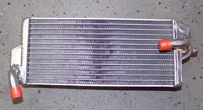 RADIADOR MISHIMOTO MMDB-RMZ250-04L: IZQUIERDA SUZUKI RMZ250 04-2006 Foto 1 de 2