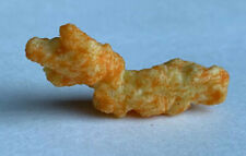 CHEETO SHAPED LIKE A CHINA DRAGON BOAT. STANDS UP VERTICALLY
