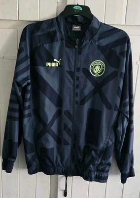 Manchester City Black Pre- Match Jacket 2022/23 (ADULTS Small SIZE) 21" X 28" - Image 1 of 4