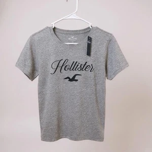 Camiseta para mujer Hollister XS gris ligera azul marino con logotipo nueva con etiquetas - Imagen 1 de 1