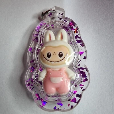 +Regalo gratis labubu con amuleto de aceite metta para dijes Foto 1 de 4