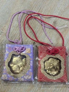 Two 24K Gold Foil Lucky Maneki Cat Omamari Purple & Red Silk / Chinese New Year - Picture 1 of 6