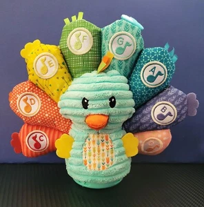 Infantino Learning and Musical Peacock 9 inch Plush Stuffed Animal - Picture 1 of 4