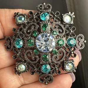 Black toned 1928 brand blue and green crystal brooch - Picture 1 of 7
