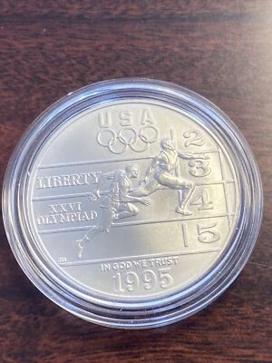 1995-D Unc Olympic Track & Field Commemorative Silver Dollar $1 - Image 1 of 2