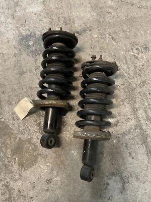 Par de amortiguadores de resorte de puntal delantero izquierdo derecho Nissan Titan 2004-2015 OEM Foto 1 de 4