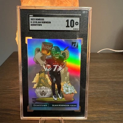 2023 Panini Donruss - Downtown #D-10 Bijan Robinson (RC)  SGC Gem Mint 10 - Image 1 of 2
