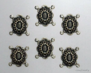 #3462 CONECTOR DE 4 ANILLOS DISEÑO FLORAL ORO ANTIGUO - Lote de 6 piezas - Imagen 1 de 2