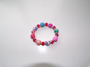 BRACCIALE MODA ELASTICIZZATO CON PERLINE FLOREALI - Foto 1 di 3