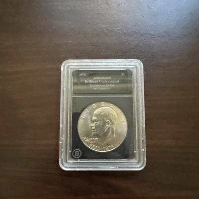 1976 Authenticated Brilliant Uncirculated Eisenhower Dollar Coin BA17-00040_007  - Image 1 of 3