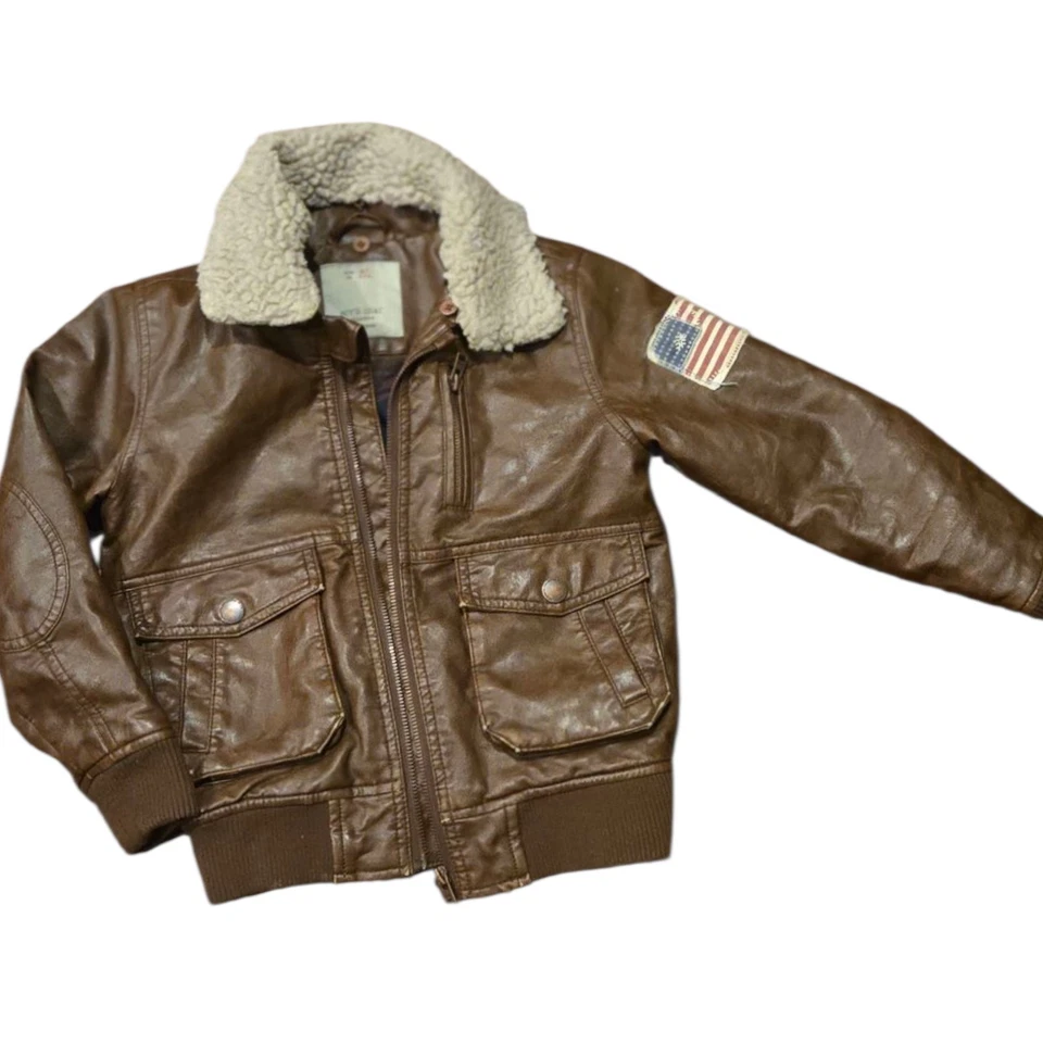 Chaqueta de bombardero de aviador Zara para niños 6/7 abrigo de cuero sintético cuello sherpa forrado a cuadros Foto 1 de 4