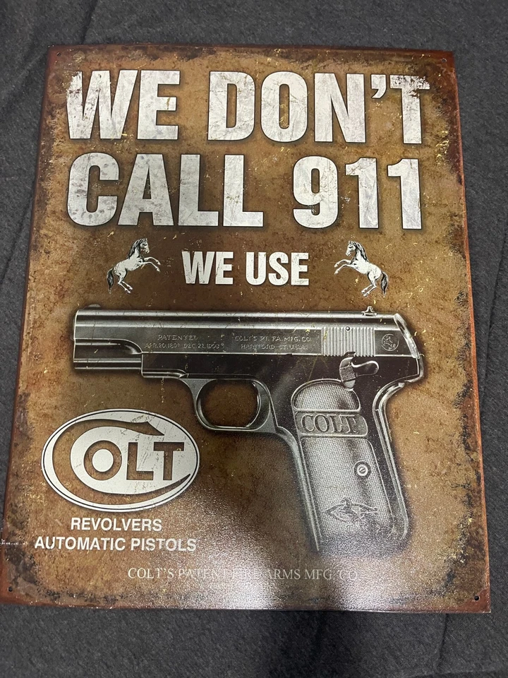 COLT AUTOMATIC PISTOLS & REVOLVERS TIN SIGN WE DONT CALL 911 WE USE COLT 12.5X16 - Image 1 of 1