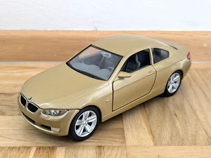Modellino auto firmato strada 1:24 BMW 335i Coupè 2007 oro - Foto 1 di 7