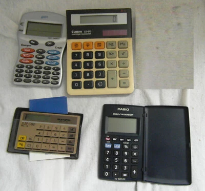 Lot de 4 anciennes calculettes, machine à calculer, Canon, Casio - Photo 1/4
