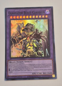 Yu-Gi-Oh! TCG Gladiatore Bestia Claudio SUDA-EN038 Super Rara 1° Edizione NM - Foto 1 di 2