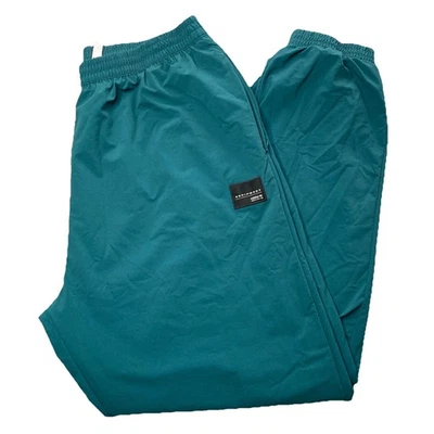 Pantalones cortavientos Adidas Equipment para hombre atléticos verdes XL forrados de malla Foto 1 de 4
