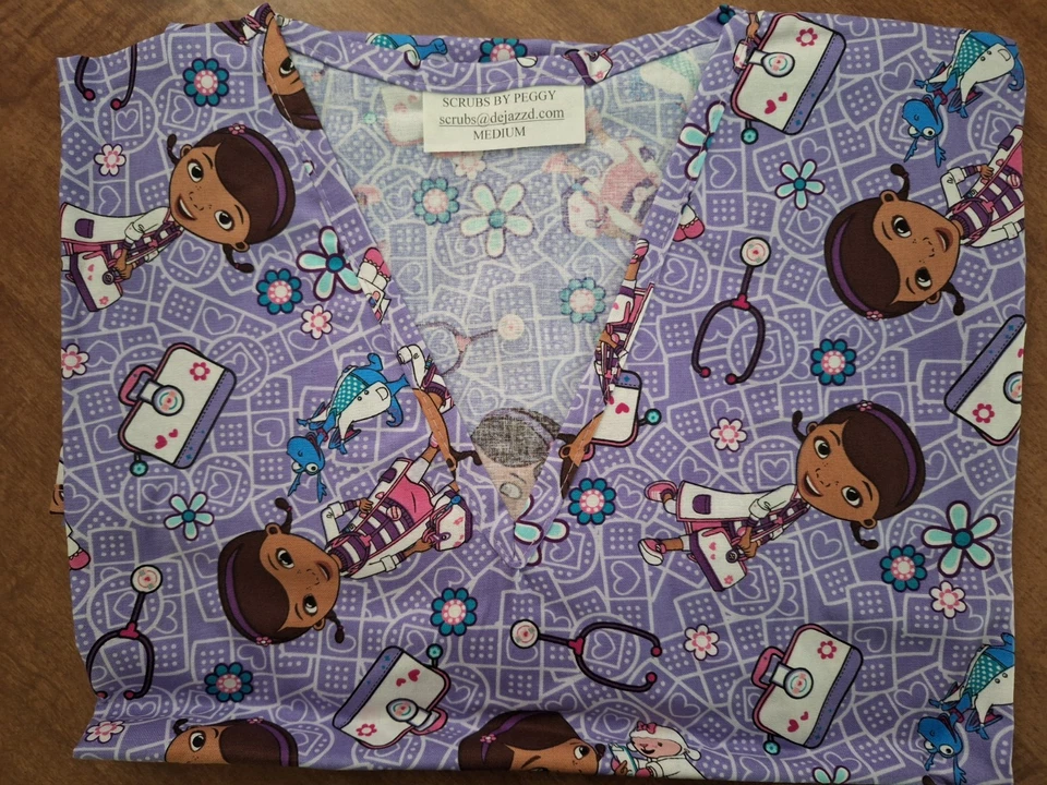 Doc McStuffin Medical Scrub Shirt SIZE MEDIUM - Image 1 of 1