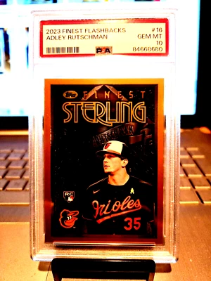 2023 Finast Flashbacks Adley Rutschman Rookie #16 Gem Mt. 10 Young Phenom Stud " - Image 1 of 4