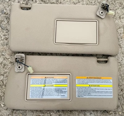 Nissan Xterra Frontier 5-12 Driver & Passenger Lighted Sun Visors Tan Cloth OEM - Image 1 of 3