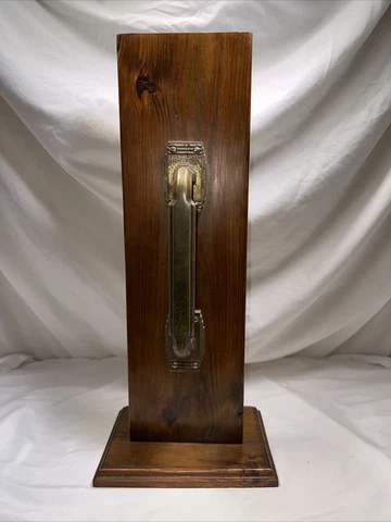 Vintage Brass Door Pull and Plate mounted on a salesman sample display Cover