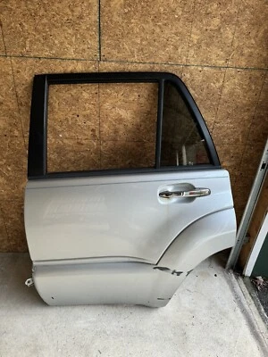 Conjunto de puerta trasera izquierda Toyota 4Runner 2006-2009 OEM plateado 1D4 Foto 1 de 3