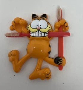 Vintage Garflield Zahnbürstenhalter + 2 Zahnbürsten (nur zur Anzeige benutzt) - Bild 1 von 6