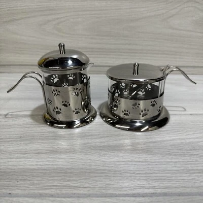 Juego de crema y azúcar de plata y plástico (tal vez vidrio) con impresiones de patas de cuchara Foto 1 de 4