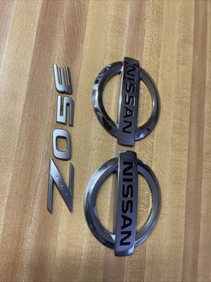 OEM 2003-2009 Nissan 350Z Front Rear TrunkHatch Emblem Badge Letters - Image 1 of 4