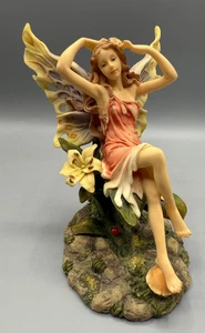 Estatuilla de fijación de pelo de hadas de diseño veronés con flor, colección Summit, 2001 - Imagen 1 de 18