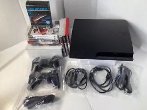 Sony PS3 Slim Konsole mit 2 Wireless + 1 Navi Controller + 8 Spiele + Verstärker - Bild 1 von 22