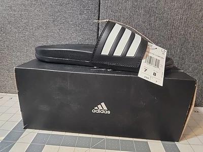 ОСТАЛОСЬ ТОЛЬКО! Унисекс Adidas Adilette комфорт слайд черный GZ5891 мужчин 7 женщин 8 читать - Изображение 1 из 4