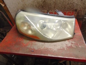05 04 03 Saturn L200 OEM lado pasajero derecho faro luz montaje lámpara - Imagen 1 de 2