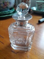 silver topped perfume bottle