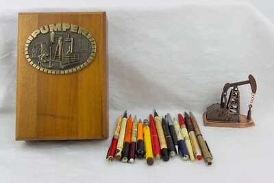 Artículos publicitarios al óleo, camiones y tierras; caja de madera, sacapuntas y bolígrafos/lápices Foto 1 de 4