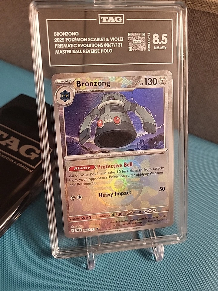 TAG 8.5 Bronzong Master Ball 067/131 Pokemon Prismatic Evolutions - Image 1 of 1
