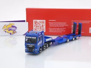 Herpa 316156 # MAN TGX GX4/3-achs Tieflade-SZ " Martin Baur Transporte " 1:87 - Bild 1 von 4