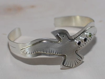 handmade bird bracelet in sterling with garnet and peridot - Image 1 of 4