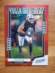 2024 Panini Prestige Tyree Wilson Youth Movement Red 327/399 #YM-TWN Raiders - Bild 1 von 3