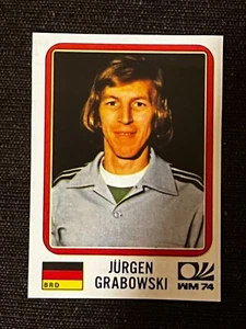 AUFKLEBER PANINI WELTCUP MÜNCHEN 74 JÜRGEN GRABOWSKI DEUTSCHLAND # 99 RECUP ENTFERNT - Bild 1 von 1