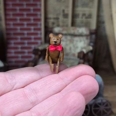 Miniature Dollhouse Hand-Carved Wooden Jointed Teddy Bear With Red Bow - Image 1 of 4