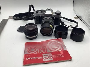 Olympus OMG SLR 35mm CAMERA 2 Lens 135mm 50mm Zuiko Caps book Cannon LA-DC52G - Picture 1 of 12