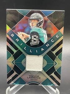 2023 Spectra Trevor Lawrence Silver Prizm Brilliance Jersey Memorabilia #95/99 - Picture 1 of 4