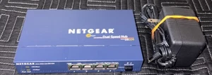 Netgear DS104 4-portowy koncentrator 10/100 Mbps z podwójną prędkością z zasilaczem testowany zasilaniem - Zdjęcie 1 z 1