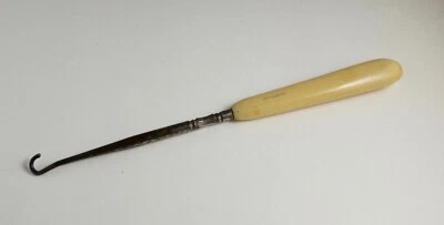 Antique shoe button shoe lace hook "ivory pyralin" handle - Image 1 of 4