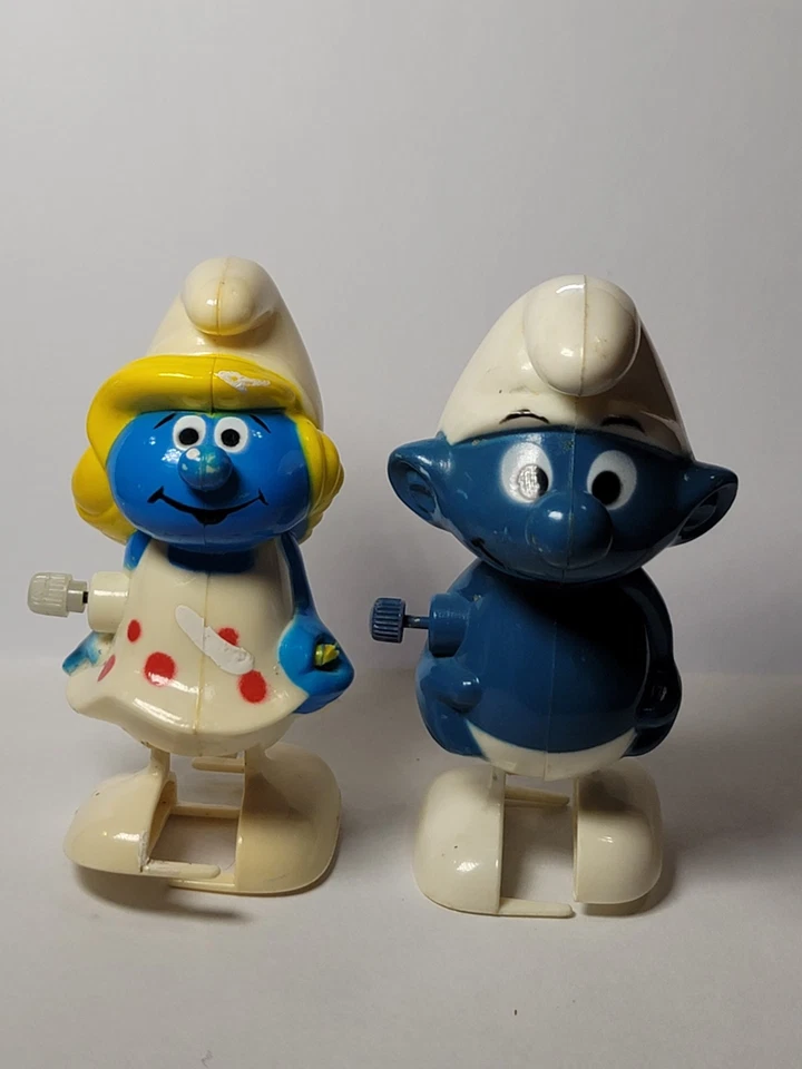 Vintage 1980 & 1982 Galoob Peyo Wind Up Walking Smurf and Smurfette Toy Lot Of 2 - Image 1 of 4