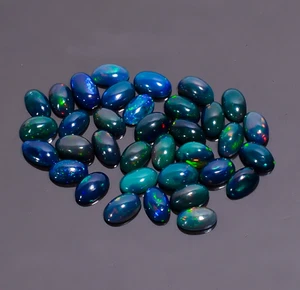 Cabujones naturales negros ópalo etíope forma ovalada lote de 35 piezas 6,00 quilates 5x3x2 mm - Imagen 1 de 3