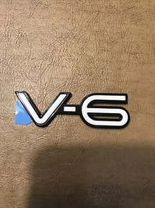 NOS GM 22571273 OEM 1994 - 1998 Pontiac Grand Am V-6 Fender Emblem - Bild 1 von 4