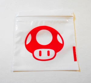 100 Pack, Red 1-UP Mushroom 2x2 Zip & Lock White Plastic Jewelry Bags 2020 Mario - Picture 1 of 2