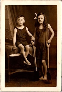 ADORABLE SIBLINGS : BATHING SUITS : BEACH : SHOVELS AND A PAIL : RPPC - Picture 1 of 3