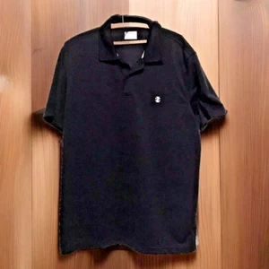 Izod Polo Shirt Mens XL Black Golf Short Sleeve Ribbed Logo Travel Sports - Picture 1 of 6